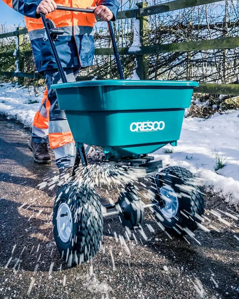 Cresco walk-behind spreader spreading salt