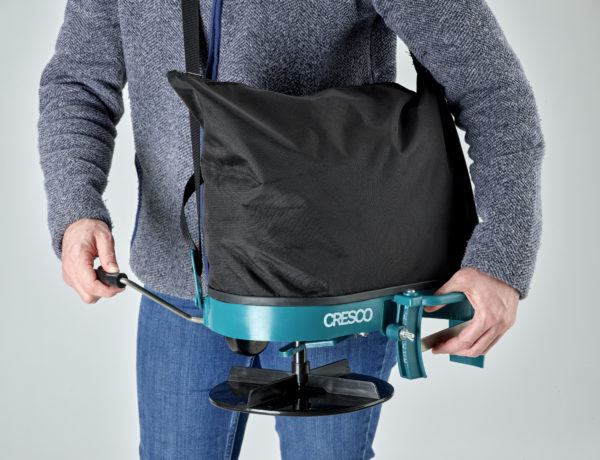 An operator holding a Cresco 5 shoulder mounted spreader